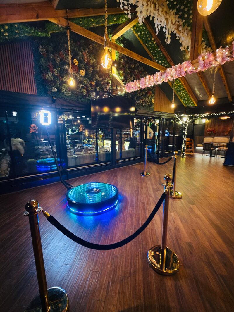 Infinity 360 booth set up in a floral venue
