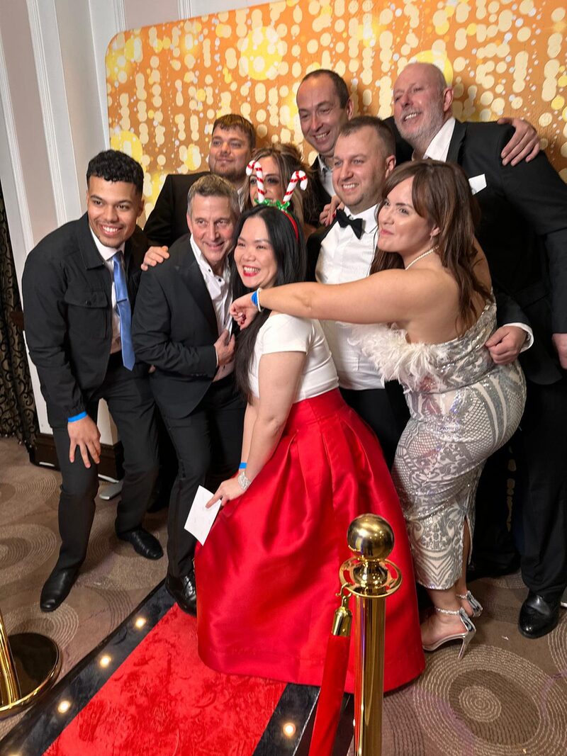 Guests at a black-tie awards night around the booth