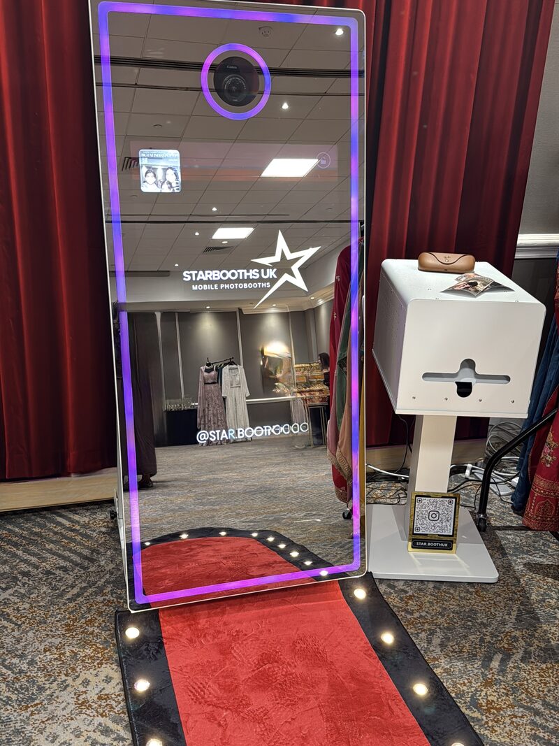 Interactive mirror booth and print station at a wedding event